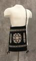 Shoulder Bag of black wool with a woven ornate design at center blocked by patterned bands in white wool