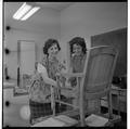 Home Economics students working to upholster a chair, February 1964