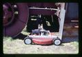 Lawn mower used for clipping on field burner (thermal sanitizer), Oregon, June 1971