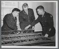 Army Corps of Engineers officers viewing model bridge, circa 1951