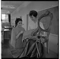 Students examining chair textiles, February 1964